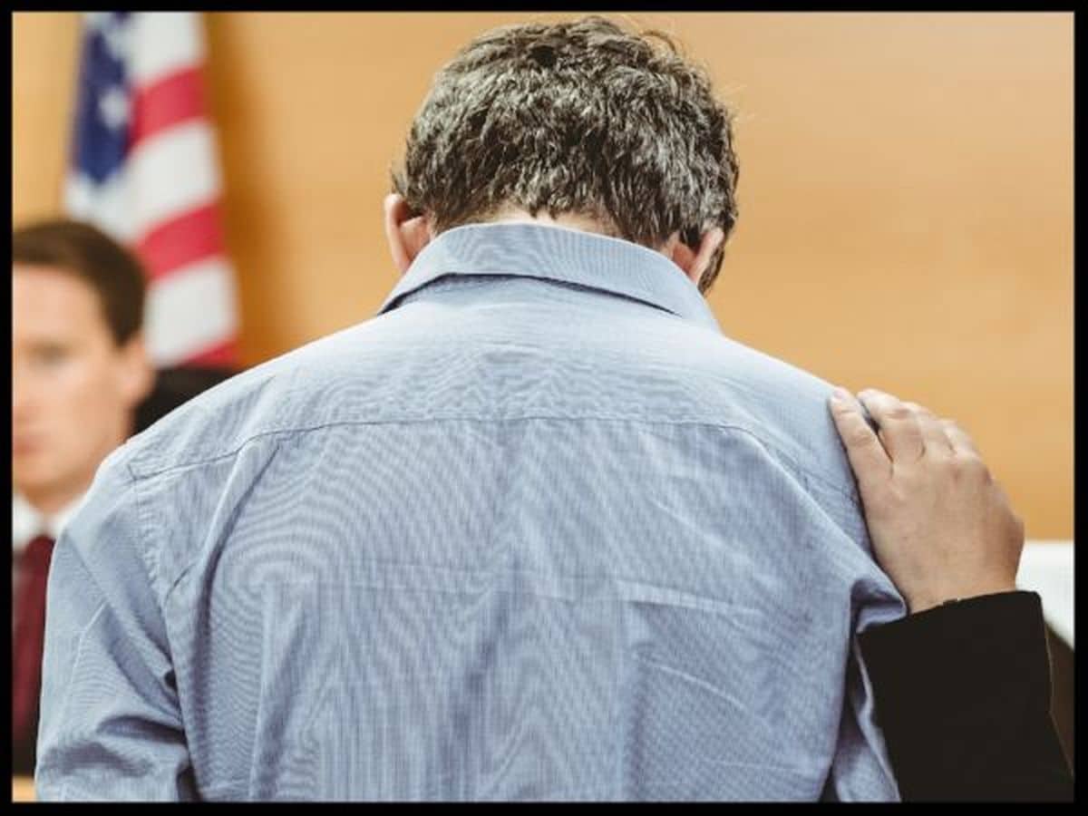 Man Arraigned before Judge with Arraignment Lawyer beside Him